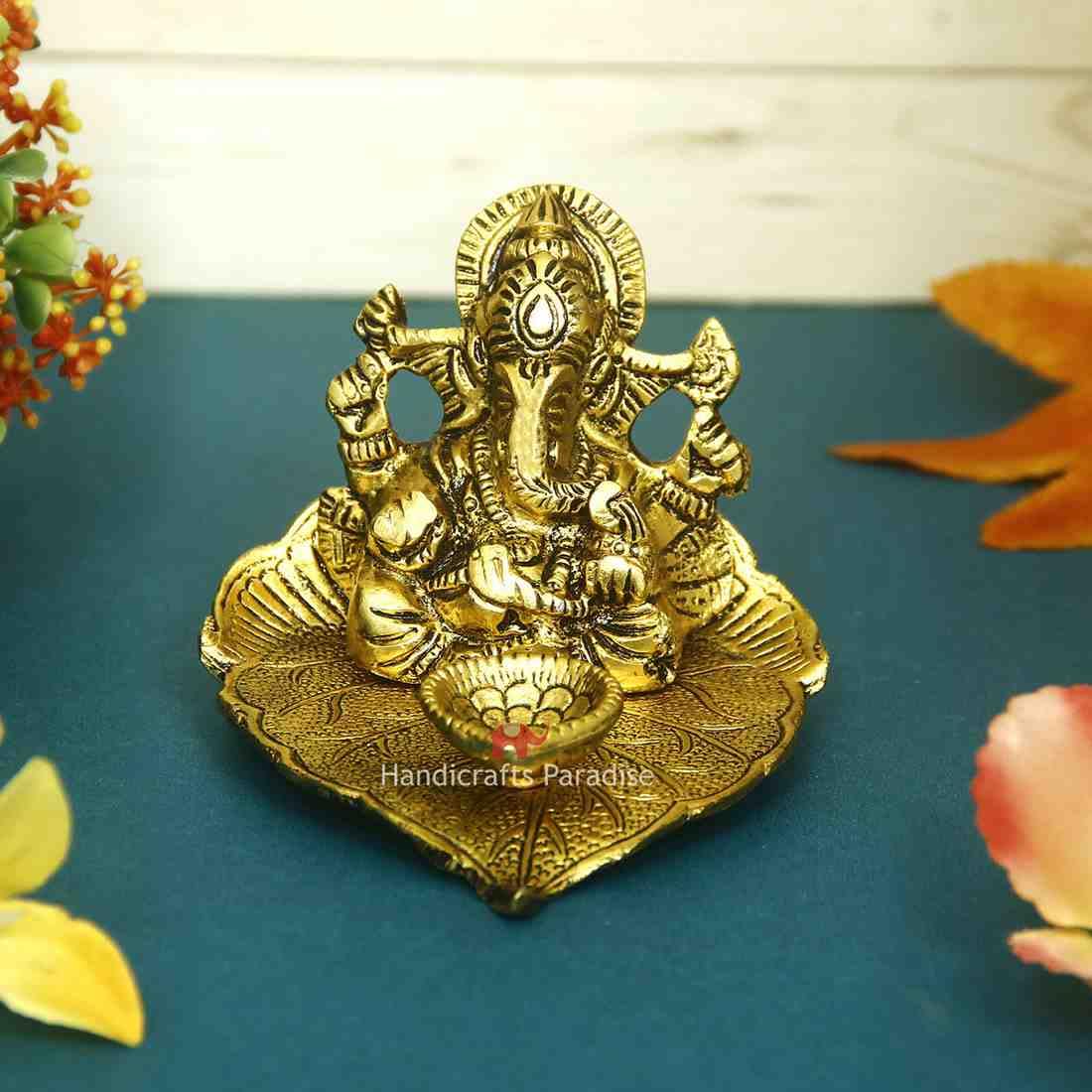 Handicrafts Paradise Diya - Pipal Leaf Shape, Ganesha, Antique Gold Plated, Metal, 4X5 Inches, Golden, Model Oxm18011