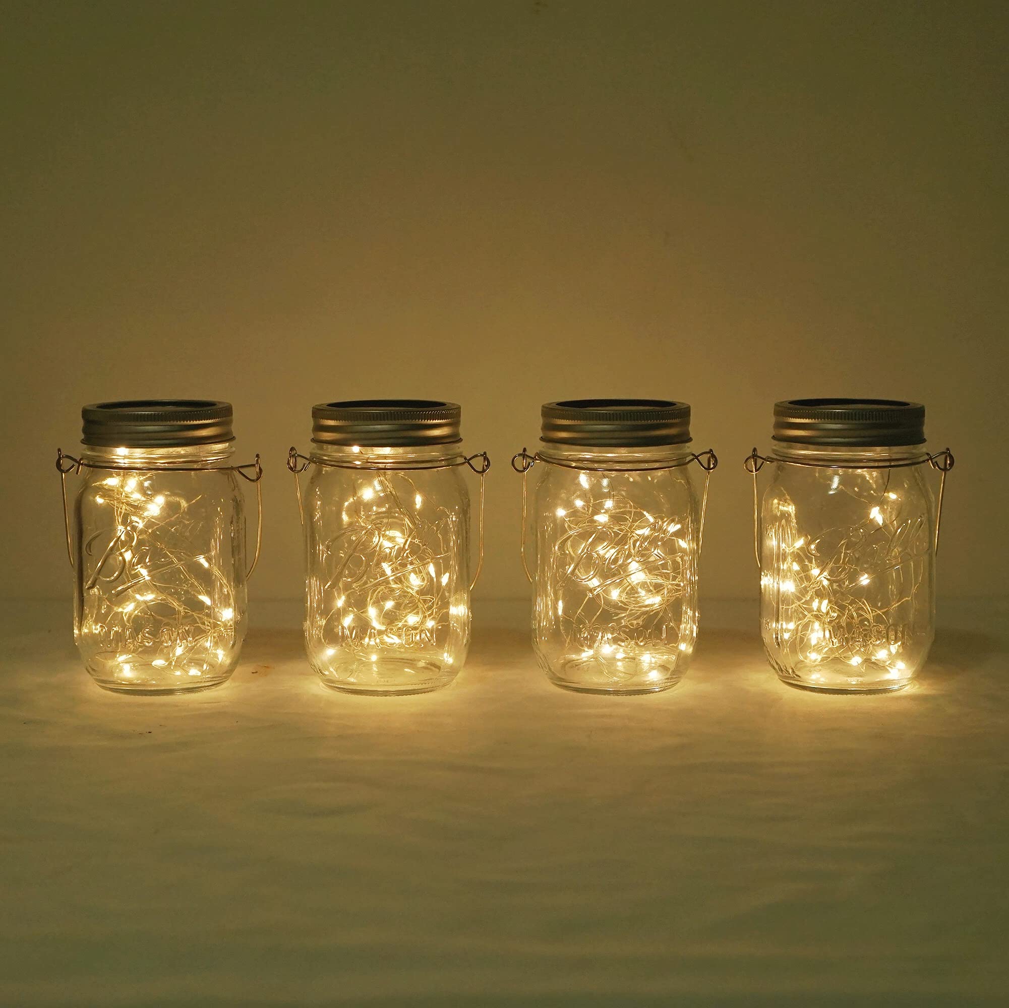 Decorman Solar Mason Jar Lights, 4 Pack 30 LED Fairy Star Firefly String Lids Lights with 4 Hangers for Patio Yard Garden Party 