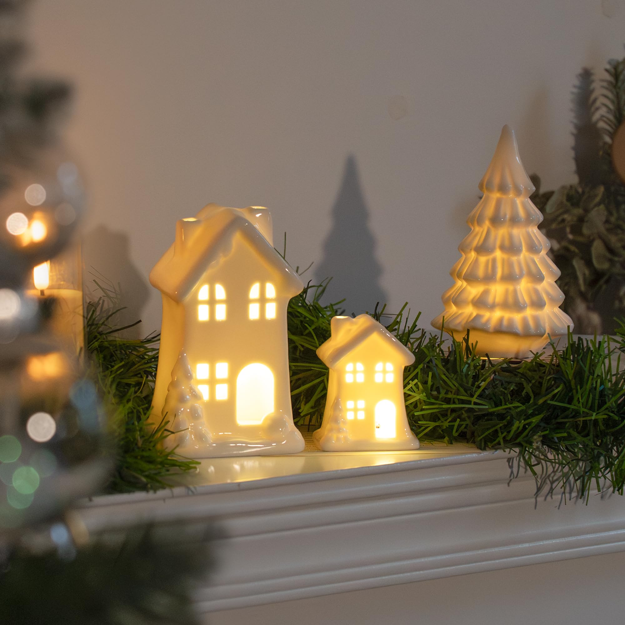 Nerosun Ceramic Christmas Village Houses  3Pcs Led Lighted Porcelain White Small House And Xmas Tree Tabletop Figurines  Light Up Christmas Decorations For Home Shelf Cabinet Table Winter Decor