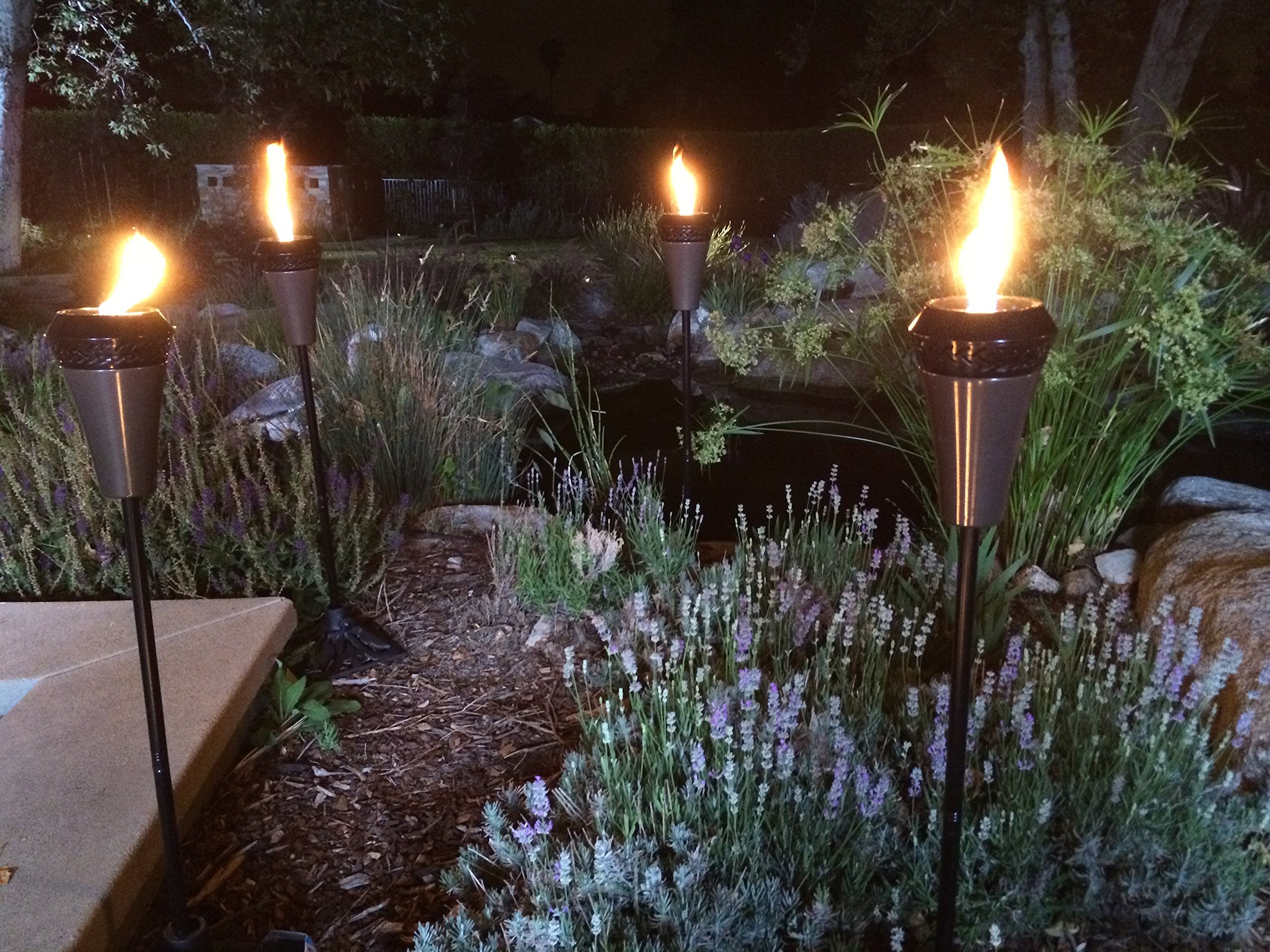 Tiki Island King 65&quot; Metal Outdoor Torch – Weather-Resistant Decorative Torch With Long-Lasting Wick, Snuffer & Easy Refill For Backyard, Patio & Garden, Brown