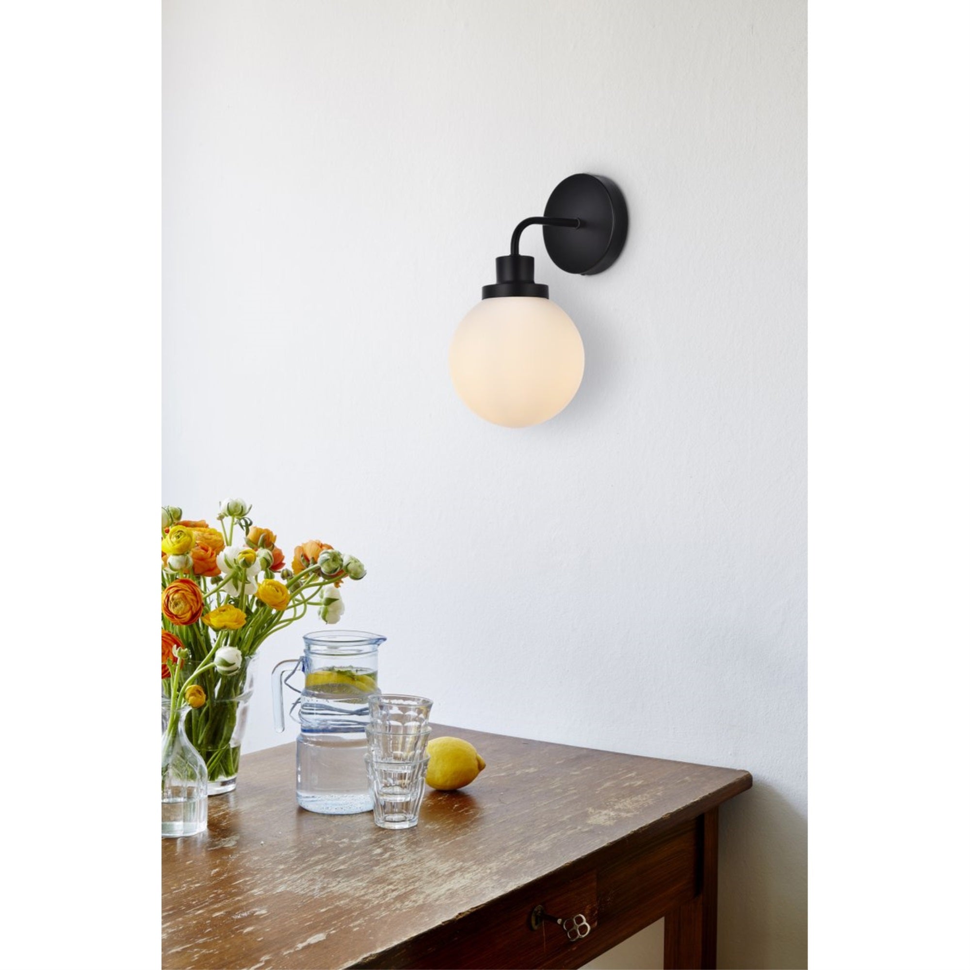 Hanson 1 light bath sconce in black with frosted shade