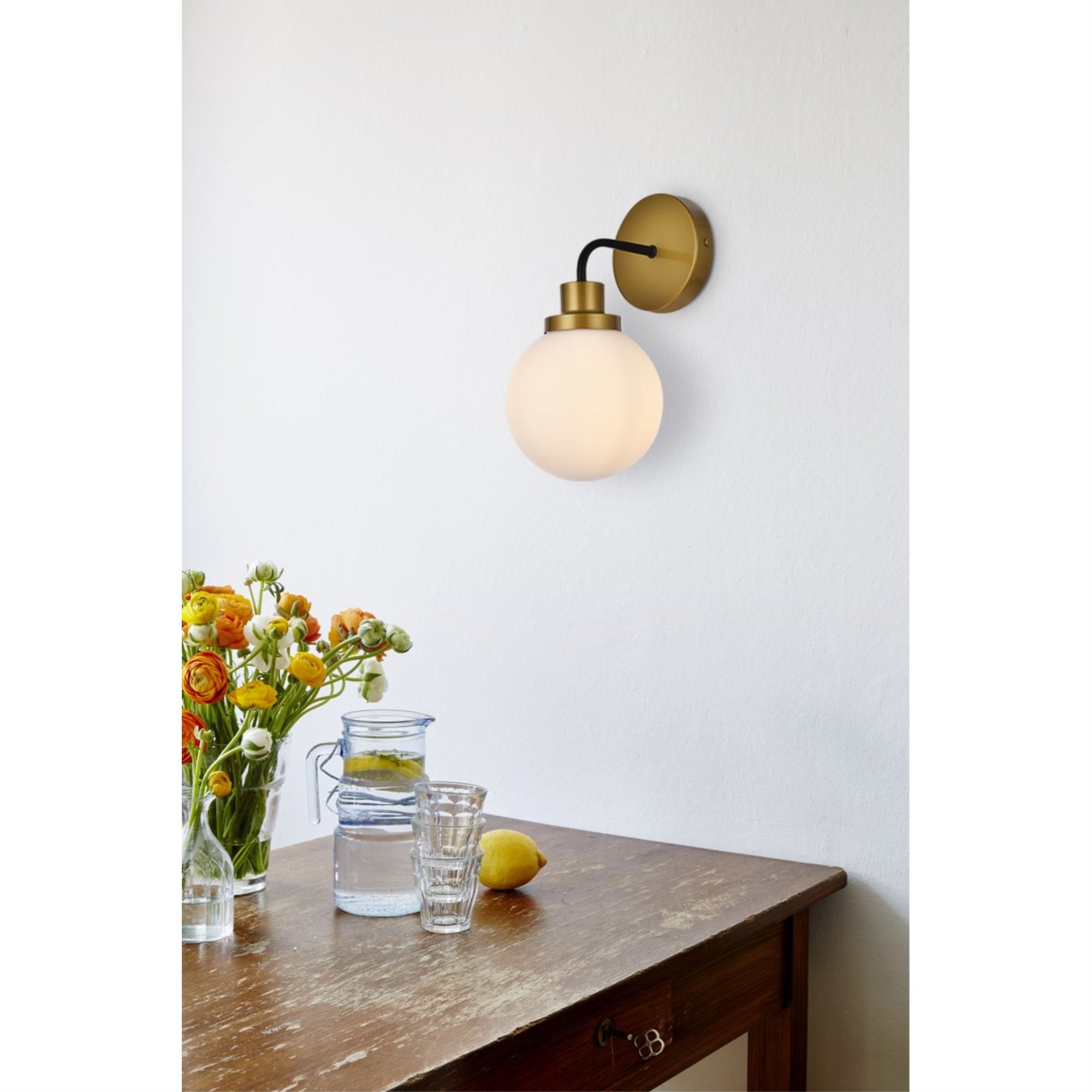 Hanson 1 light bath sconce in black with brass with frosted shade