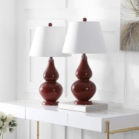 Casting a colorful glow in any room the sparkling Chinese red Cybil Double Gourd Glass Lamp is adorned with coordinating red finial base and neck Topped with a beautifully tapered pure cotton shade that illuminates the room Assembly required this lamp mea