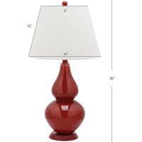 Casting a colorful glow in any room the sparkling Chinese red Cybil Double Gourd Glass Lamp is adorned with coordinating red finial base and neck Topped with a beautifully tapered pure cotton shade that illuminates the room Assembly required this lamp mea