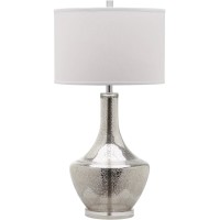 Cast a romantic glow in your living room or bedroom with the transitional silver mercury table lamp by Safavieh Inspired by vintage mercury glass the silvery crackle glass urnshaped base is contrasted by a crisp white cotton contemporary drum shade