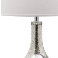 Cast a romantic glow in your living room or bedroom with the transitional silver mercury table lamp by Safavieh Inspired by vintage mercury glass the silvery crackle glass urnshaped base is contrasted by a crisp white cotton contemporary drum shade