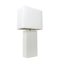 This fashionable table lamp with its leather body and white fabric shade will add style and pizzazz to any room We believe that lighting is like jewelry for your home Our products will help to enhance your room with elegance and sophisticationFeaturesLeat