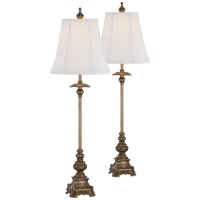 Light up a room with this twopiece set of traditional buffet table lamps from the Regency Hill lighting brand Each lamp comes in a light bronze finish frame with intricate detailing that adds a rich and elegant look and is topped by a bell shade that prov