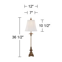 Light up a room with this twopiece set of traditional buffet table lamps from the Regency Hill lighting brand Each lamp comes in a light bronze finish frame with intricate detailing that adds a rich and elegant look and is topped by a bell shade that prov