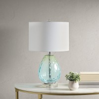 pUrban Habitat Borel Table Lamp Beautifully designed this glass table lamp flaunts a gorgeous blue and green hue that adds a soft touch of color to your room The white drumshaped lamp shade tastefully accents the base while softly filtering the light to g