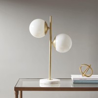 pUpdate your space with the unique style of the INKIVY Holloway Table Lamp This table lamp features a white glass shade and a metal fixture with a gold finish for a striking contrast The rounded shape creates a truly modern look for your living room or be