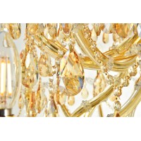 A heavenly high point to your home Maria Theresa chandeliers are ablaze with hundreds of resplendent crystals Copious strands of sparkling golden shadow crystals dangle from elaborate tiers of glasscoated steel arms in gold finish An imperial favorite for