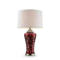 Brighten your living space and accentuate your interior dcor style with this alluring table lamp The stunning design features a curvy burgundy glass body with gold accents and a brushed brass base hand painted for a special touch Complemented with a drum 