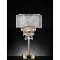 This beautiful table lamp will illuminate any room or living space Featuring a doubleshimmering translucent outer shade lined with a satin finish and a floralpatterned inner shade delicately outlined with a gold finish It has three cascading rows of cryst