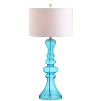 Exemplifying one of the hottest trends in home dcor the irregular curvature of this extra tall table lamp brings style to any setting Finished with a matching finial and white linen drum shade this piece would be equally at home in a foyer or at your beds