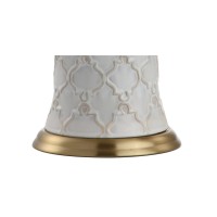 Featuring a creamcolored glaze and quatrefoil trellis texture this transitional table lamp boasts modern elegance to complement any contemporary decor The hardback linen shade offers sleek contrast to the textured base while the brass pedestal fittings an