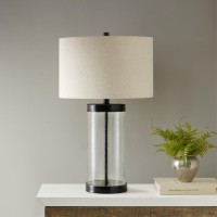 pAdd an elegant charm to your home with the Hampton Hill Macon Table Lamp This stylish table lamp is made from a painted bronze metal and a clear glass base that adds dimension and charm A drum shade shape helps accentuate the design Illuminate your livin