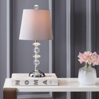 Add gracious style to the living room with this contemporary table lamp Its delicately crafted clear spheres and matching posh finial and base are perfectly paired with its complimentary grey shade An investment in modern luxury designers use in pairs