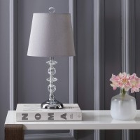 Add gracious style to the living room with this contemporary table lamp Its delicately crafted clear spheres and matching posh finial and base are perfectly paired with its complimentary grey shade An investment in modern luxury designers use in pairs