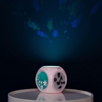 The kube is a sound activated night light that helps baby fall asleep by playing soft soothing music while projecting soft images on the ceiling