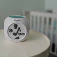 The kube is a sound activated night light that helps baby fall asleep by playing soft soothing music while projecting soft images on the ceiling