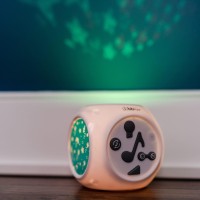 The kube is a sound activated night light that helps baby fall asleep by playing soft soothing music while projecting soft images on the ceiling