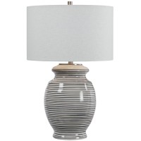 This Table Lamp has a ceramic Base Finished in an off45white glaze with Navy Blue Stripes44 Accented with Brushed Nickel Details46 The Lamp has a White Linen Drum Shade with Natural Slubbing46 FeaturesLamps combines Premium Quality Materials with Unique H