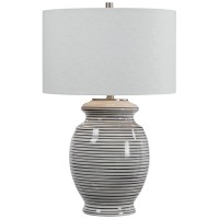 This Table Lamp has a ceramic Base Finished in an off45white glaze with Navy Blue Stripes44 Accented with Brushed Nickel Details46 The Lamp has a White Linen Drum Shade with Natural Slubbing46 FeaturesLamps combines Premium Quality Materials with Unique H