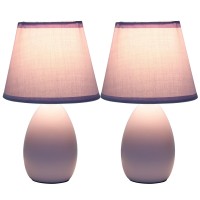 A lovely inexpensive and practical table lamp set to meet your basic fashion lighting needs These mini lamps feature an oval shaped ceramic base and matching fabric shades Perfect for living room bedroom office kids room or college dorm