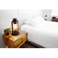 Electric Lantern Table Lamp For Bedrooms To Give You The Perfect Farmhouse Look Large 15 Inches Tall With Large Hurricane Glass And In Line Cord Dimmer. Rustic Rust Patina Hand Finish.