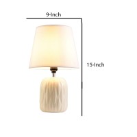 Featuring contemporary style table lamp with cylindrical ripped pattern base and flared shade to add an elegant touch to your room This table lamp can be used in various ways such as a table lamp night lamp for working or reading in the night