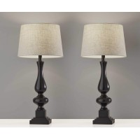 Transform your space with this sturdy and stylish pair of table lamps At 2834 high with a thick column style base these lamps are s stately presence in any room A decorative black base is paired with a classic modified drum shaped natural textured fabric 