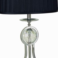 Enlighten your home with this metal made Table lamp featuring rectangular shaped shade available in a set of 2 It has been accented with a pleated design on its outer body The elegant scrolled metal base conjoined with block support and oversized crystal 