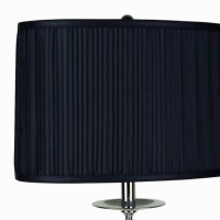 Enlighten your home with this metal made Table lamp featuring rectangular shaped shade available in a set of 2 It has been accented with a pleated design on its outer body The elegant scrolled metal base conjoined with block support and oversized crystal 