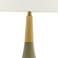 This beautiful piece of table lamp suites well with different types of decor settings due to its simple yet appealing modern design It has a concrete base which provides a sturdy support to the lamp It is incorporated with a white finish lamp shade