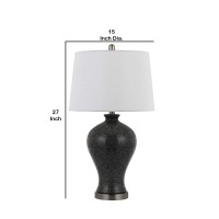 Complete the look of your sitting area with the inclusion of this ceramic made table lamp available in set of 2 Urn shaped silhouette and tapered drum shade completes the look and makes it an ideal piece of addition