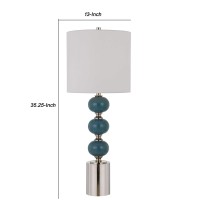 Bestow your home with this elegant and charming table lamp available in set of 2 Stacked ball design ceramic body with cylindrical shaped base completes the look and makes it a piece worth addition Fabric round shade adds to its look