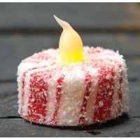 The Glittered Candy Cane LED Tealight is a textured light with a candy cane aesthetic It boasts a builtin timer and requires one 3V battery to operate Place this tealight on a festive holder and pair it with similar lightsto craft a lovely holiday accent 