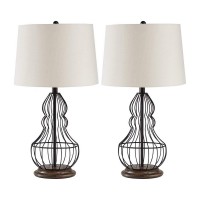 Add a stylish look to home decor by lighting up this amazing table lamp available in a set of 2 It features a metal body in a ground shape incorporating a 3 way switch for control and a tapered fabric shade that uses an A type bulb of 150 watt or 25 watt 