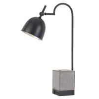 Add a sophisticated and elegant touch to you home decor by bringing this amazing table lamp It features metal frame and a cement block body incorporating an on off switch for seamless control It is supported by a stable base consisting of 1 power outlet a