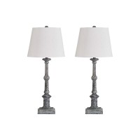 Illuminate your existing decor setting by bringing in this transitional style Table Lamp which comes with a tapered drum shade and rests on turned wooden frame with a pedestal base Wrapped with white color fabric it is accented with gray color finish