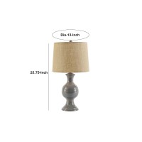 Brighten up your decor setting with the addition of this transitional style inspired Table Lamp which comes with a round drum shade Supported on bellied ceramic frame with pedestal base the gray accented base with beige color wrapped fabric add a distingu