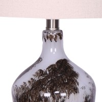 Brighten up your home with the inclusion of this table lamp featuring contemporary style The glass bottle base shade with painted abstract pattern in black hue adds to the overall look of the piece Fabric tapered shade completes the design of the piece an