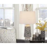 Add a tropical vibe to your space with this white ceramic leaf print table lamp It features a milky ceramic finish with gray painted accents and solid crystal base The look is completed with a white fabric shade and matching finial