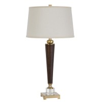 Add a touch of class to your home or office space with this elegant torch style table lamp It features a snake print leatherette body polished gold accents and solid crystal base Also includes is a matching fabric shade topped with coordinating finial