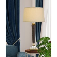 Add a touch of class to your home or office space with this elegant torch style table lamp It features a snake print leatherette body polished gold accents and solid crystal base Also includes is a matching fabric shade topped with coordinating finial