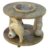 This gorgeous oil burner is constructed of solid soapstone and features three pillars in the shape of circus elephants An elegant way to diffuse the aroma of scented oil throughout your home