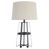 Illuminate your bedroom decor setting by bringing in this transitional style inspired Table Lamp which comes with round shape fabric shade and rests on caged metal base Incorporated with a 3 way switch it is accented in the hue of black