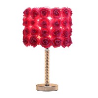 Accessorize your room with the inclusion of this stunning Table Lamp It requires a 60Watt or A19 bulb for an ample amount of light with convenient on and off switch while the bloom roses on a shade provide warm ambient lighting to the area The twisted acr