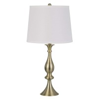 Oozing of elegance and glamorous appeal this table lamp available in set of 2 depicts perfection in its purest form The turned style body accented in golden color hue makes it appear charming and a stand alone addition The faux silk fabric shade adds rega